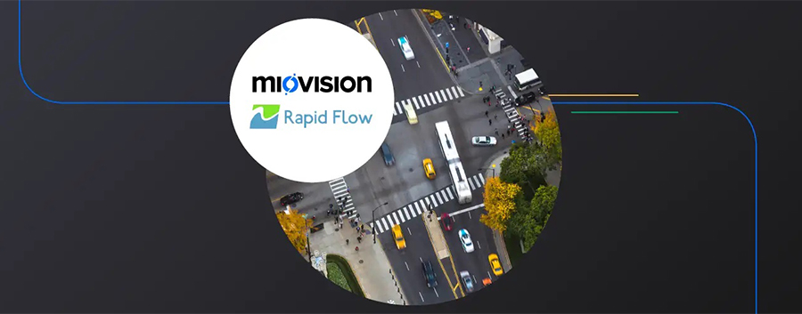  The Rapid Flow logo superimposed on a aerial view of a busy urban intersection.